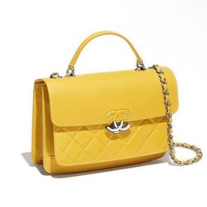 Chanel grained calfskin flap bag with silver-tone metal in yellow